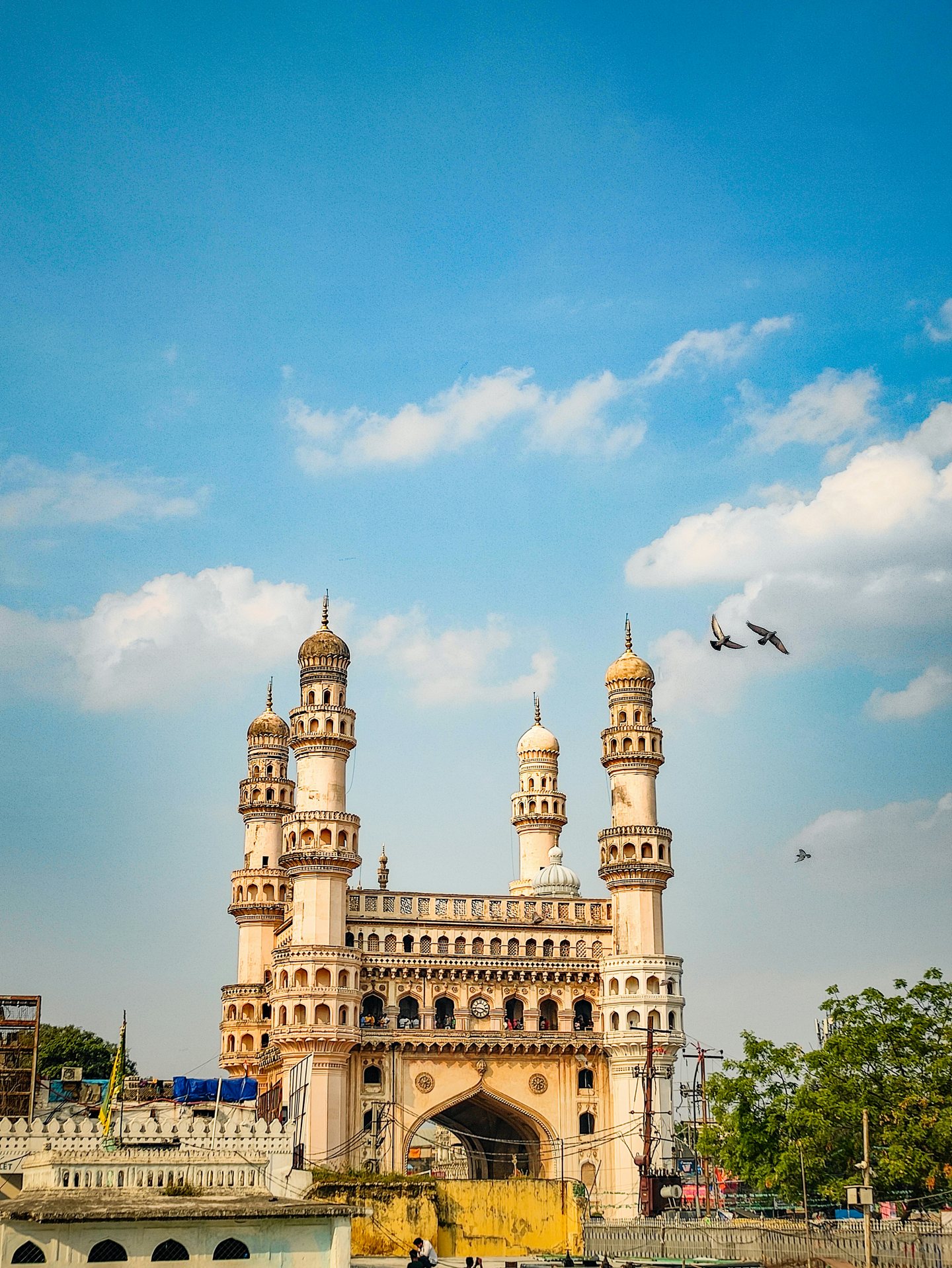 Charminar monument beneath a blue sky in Hyderabad, Telangana