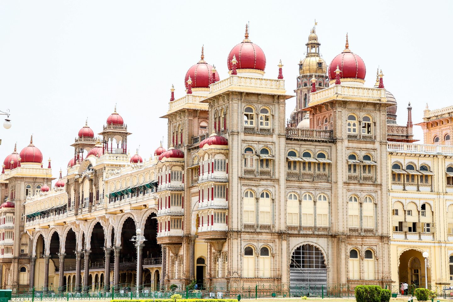 Ornate façade and red domes of Mysore Palace in Karnataka